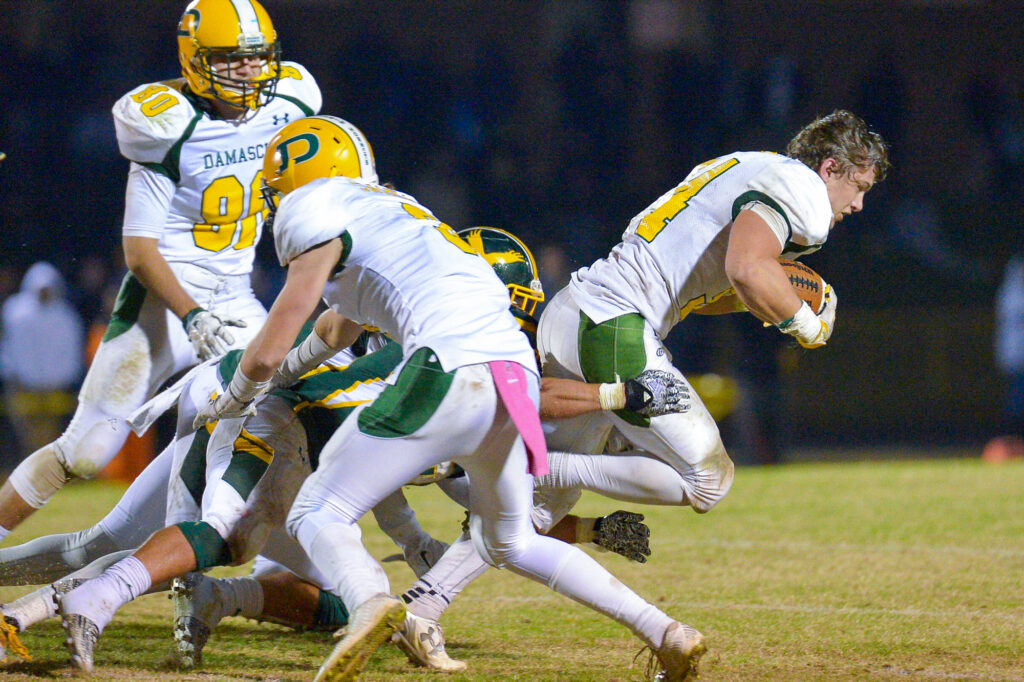 photo of Jake Funk loosing his helmet in play against Seneca Valley