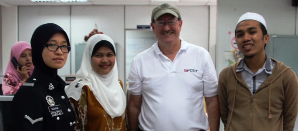 photo of author Lew Toulmin with Malaysian Police officials