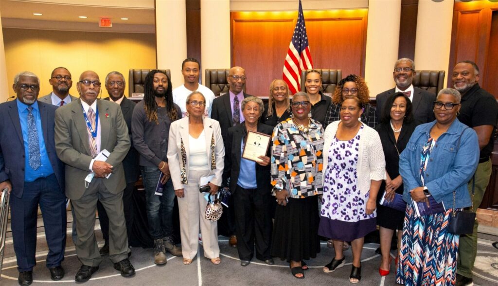 Descendants of Arthur Alexander Madison holding the induction plaque for the Alabama Lawyers Hall of Fame. Inductees must have practiced law and lived in Alabama, and have died at least two years before being nominated. Relatives or friends of the nominee must submit a package describing the person’s suitable education, character, career, ethical behavior and accomplishments.