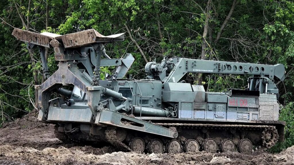 photo of a BAT-2 AEV used by the Ukrainian and Russian armies. The BAT-2 has a 13-foot wide bulldozer blade, and a 22-foot, two-ton crane for clearing obstacles.