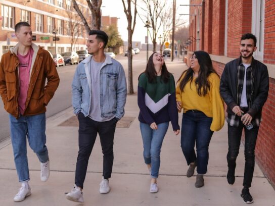 photo of college students waling down sidewalk