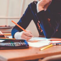 photo of teen student with pencil