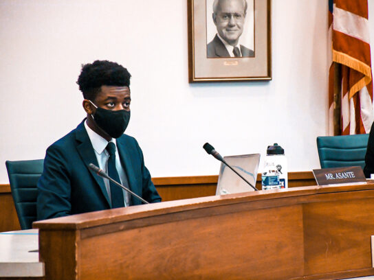 Nick Asante at school board meeting