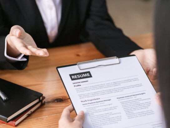 photo of job fair woman submit resume to employer to review job application the concept