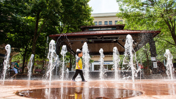 photo of child playing in water at Rockville Town Center