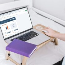 photo of a woman working on a budget on a laptop