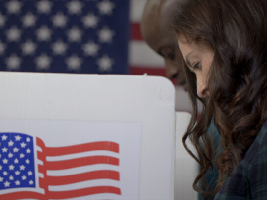 photo of woman and man voting