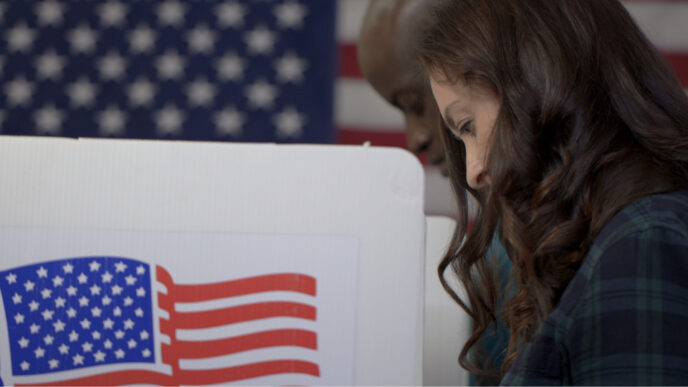 photo of woman and man voting