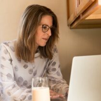 photo of woman working on a laptop