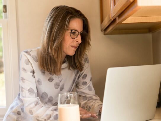 photo of woman working on a laptop