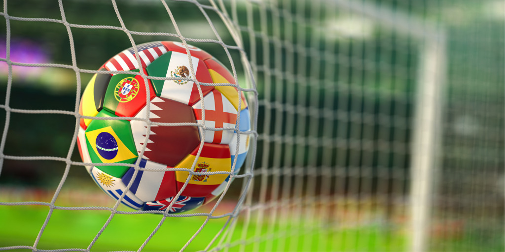 photo of soccer ball in net world cup