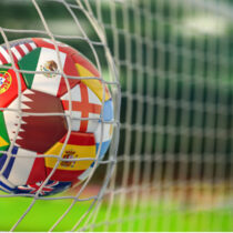 photo of soccer ball in net world cup