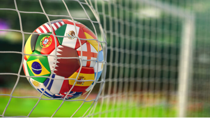photo of soccer ball in net world cup