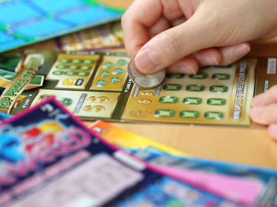 Woman scratching lottery ticket