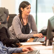 young adults working at computers together