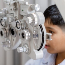 boy doing eye test exam