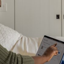 photo of woman working on a tablet