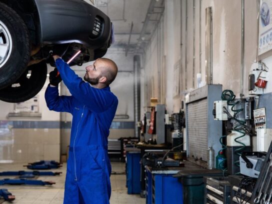 auto mechanic working on a car