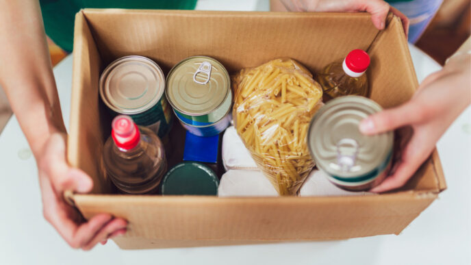 box of canned non-perishable food for donation istock