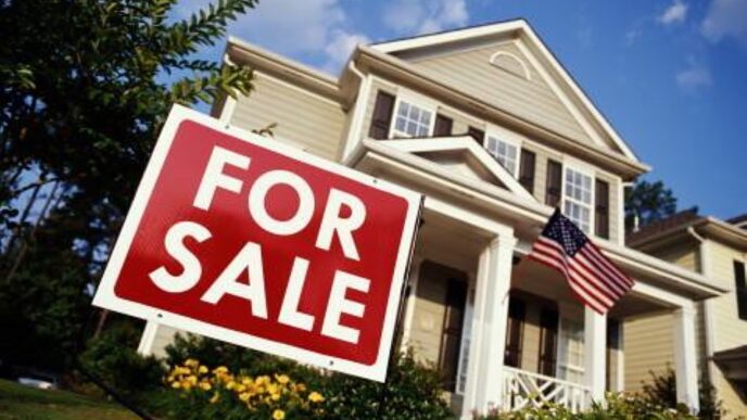 photo of home with for sale sign