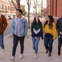 photo of college students waling down sidewalk