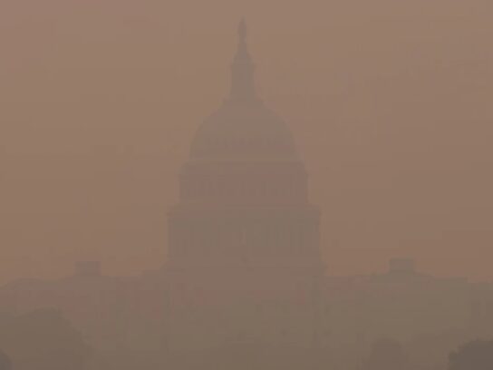 The US Capitol almost invisible in smoke from Canadian wildfires, 2023.