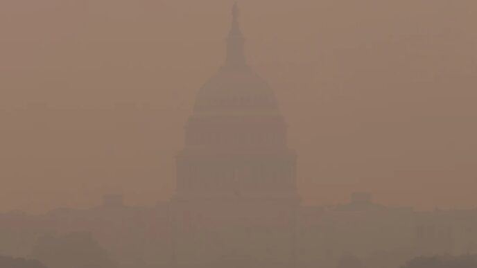 The US Capitol almost invisible in smoke from Canadian wildfires, 2023.