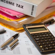 calculator pens and income tax book