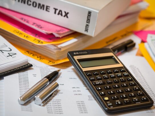 calculator pens and income tax book