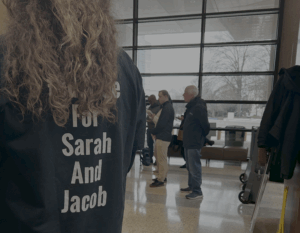 An unidentified woman wears a "Justice for Sarah and Jacob" shirt to the competency hearing and press conference involving the toddler's mother, Catherine Hoggle, who is charged with their murder.