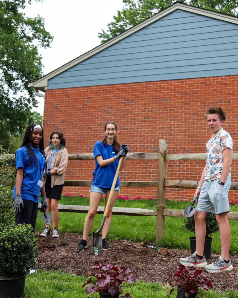 Students plant flowers and greenery