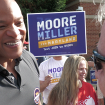 Gov. Moore with a voter at Lakelands Middle School in Gaithersburg. Photo credit: Markette Sheppard
