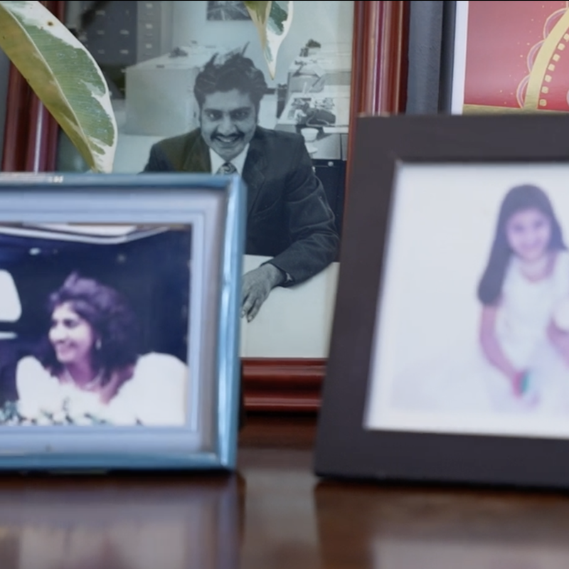 a photo of lt gov miller's father sits on her desk at the Maryalnd State House among other family photos