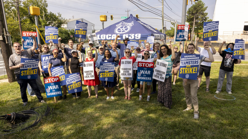 Striking workers hold signs reading "Verbal Beginnings Teamsters on Strike" outside the company's Rockville location.