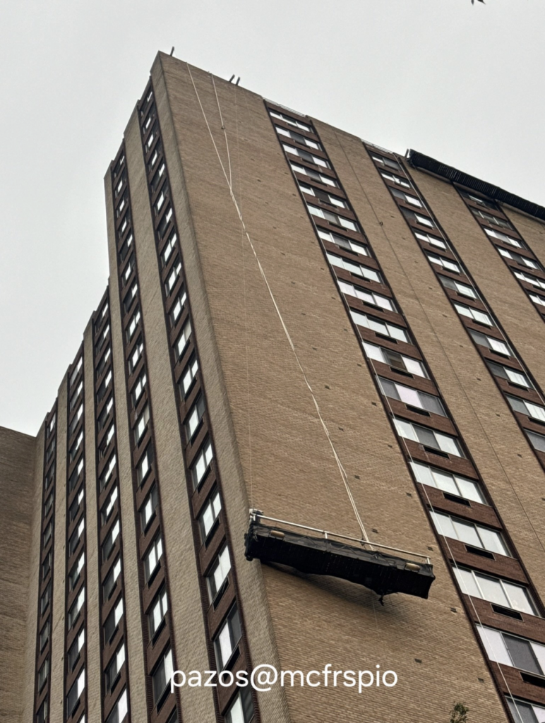 Scaffolding collapse traps two, left swinging from 9th floor