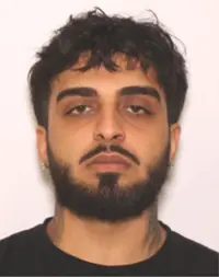 Mugshot of Shayan Solimani Damabi, wanted by Montgomery County police.