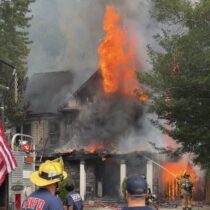Firefighters battle flames and heavy smoke at a house fire on Sonoma Road in Bethesda.