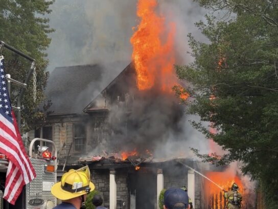 Firefighters battle flames and heavy smoke at a house fire on Sonoma Road in Bethesda.
